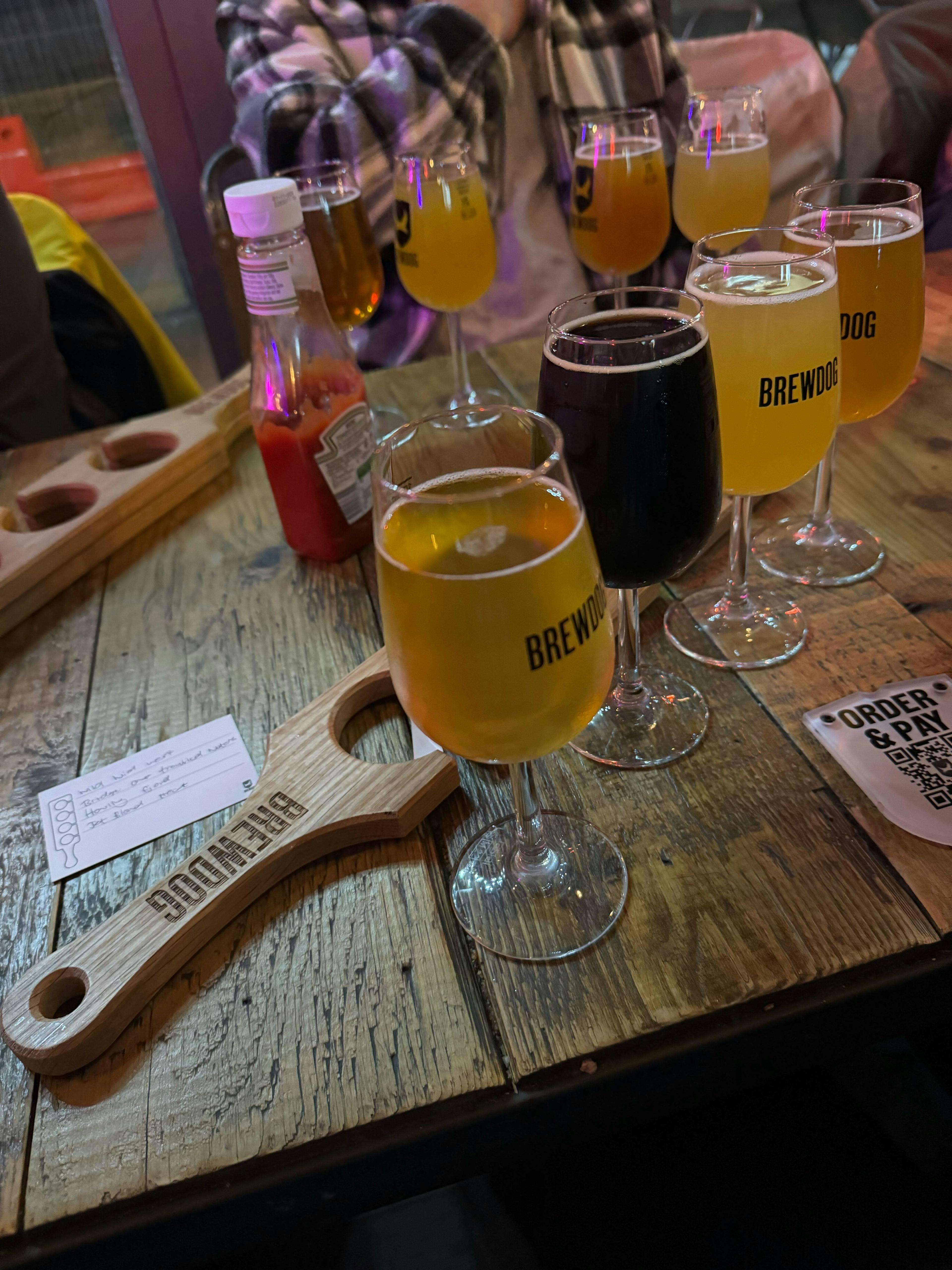 Our table at BrewDog CollabFest 2023, full of a variety of beer