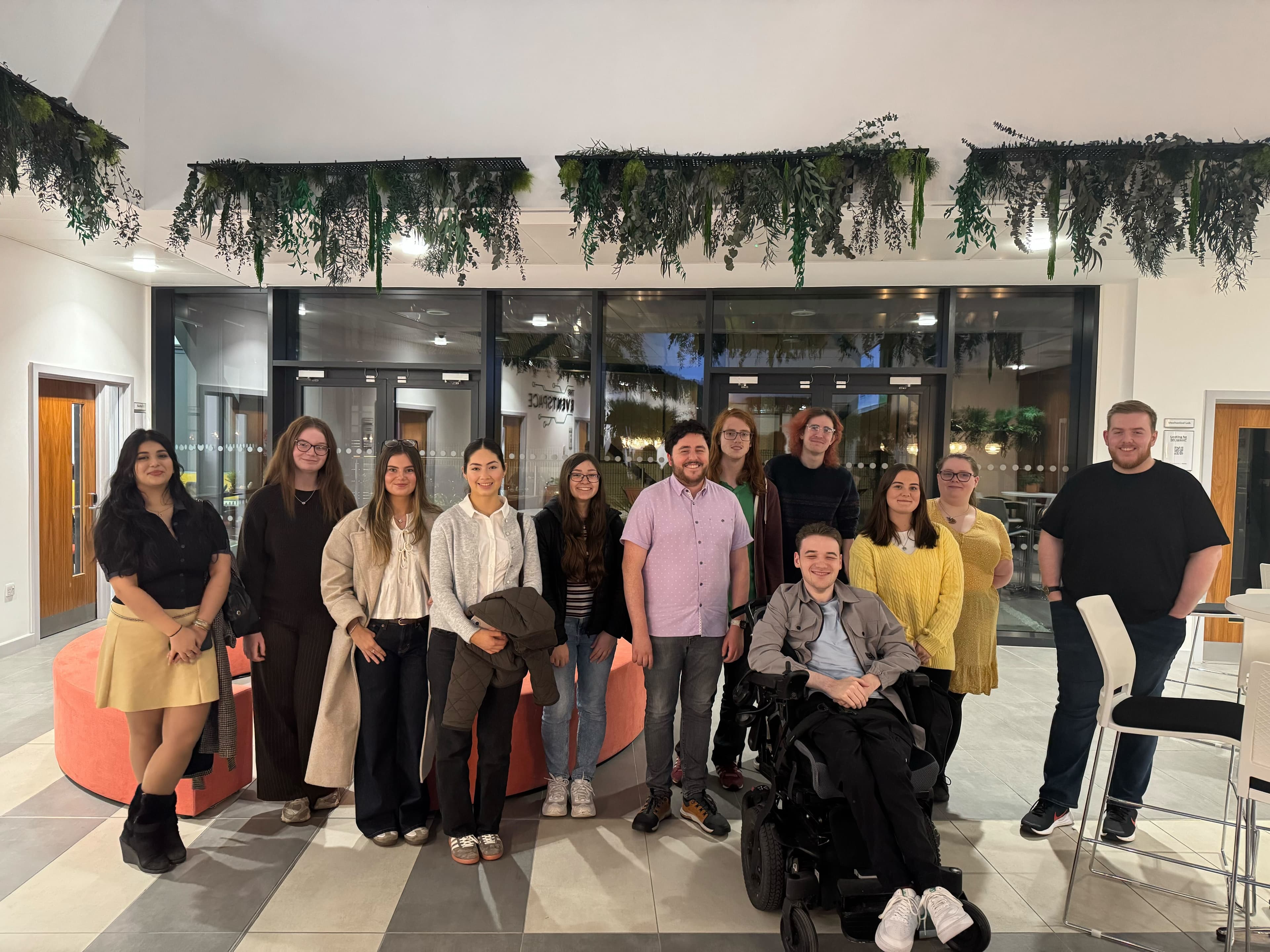 James and Zack in the CENTRAL TECH Atrium together with 10 Disability Confident Panel members, posing for the picture.